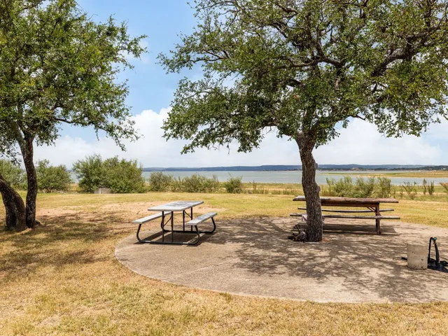 an aerial view of a houses with a lake view