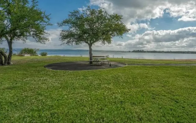 a view of a lake with a big yard