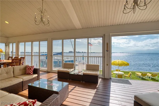 a view of a dining room with furniture large windows and wooden floor