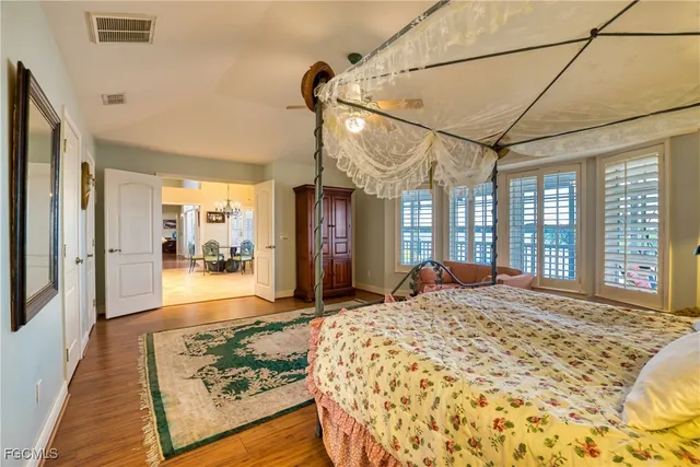a large bathroom with a sink a large mirror and a bathtub