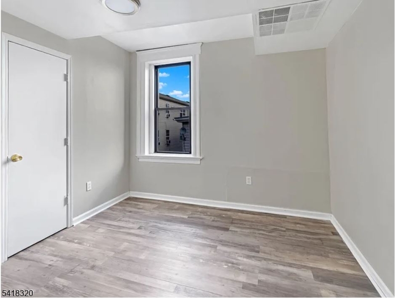 84 Second Street, Unit 4 Elizabeth Port, NJ 07206 - Photo 12 of 16 a view of empty room with wooden floor