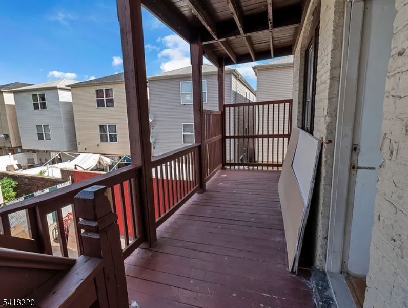 84 Second Street, Unit 4 Elizabeth Port, NJ 07206 - Photo 16 of 16 a view of balcony with wooden floor