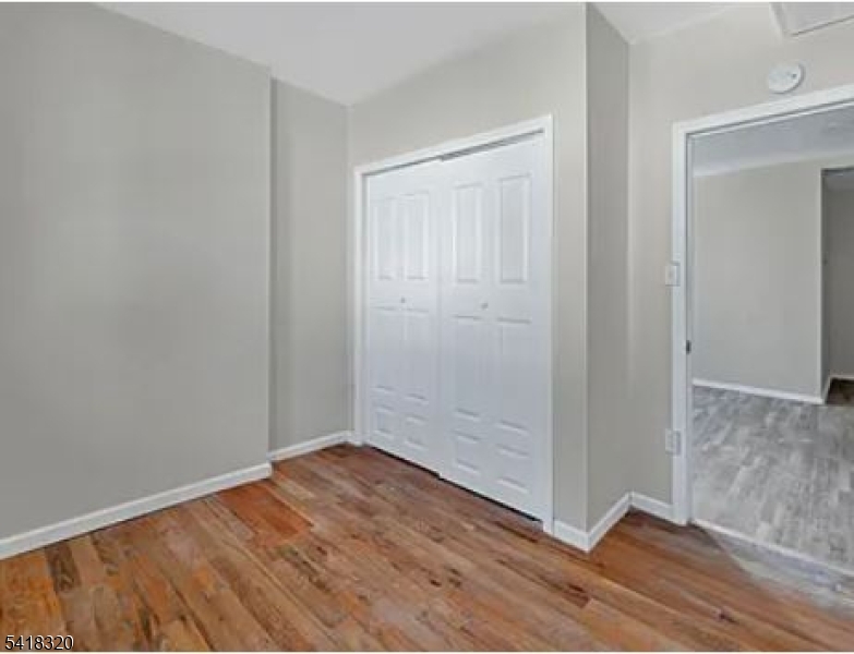 84 Second Street, Unit 4 Elizabeth Port, NJ 07206 - Photo 5 of 16 a view of small space with wooden floor