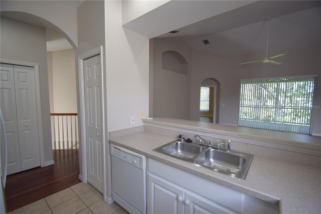 534 Grasslands Village Circle, Unit 534 Lakeland, FL 33803 - Photo 18 of 35 a bathroom with double sink and a mirror