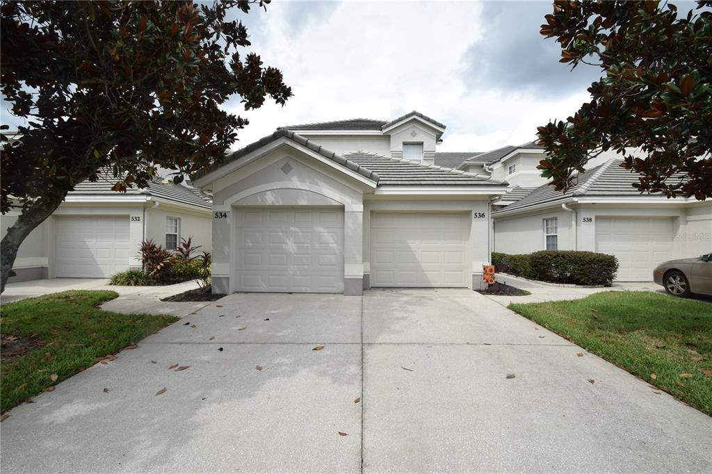 534 Grasslands Village Circle, Unit 534 Lakeland, FL 33803 - Photo 2 of 35 a view of a house with a yard