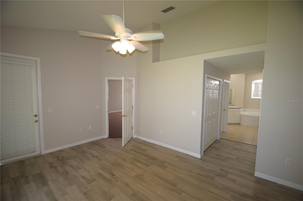534 Grasslands Village Circle, Unit 534 Lakeland, FL 33803 - Photo 24 of 35 wooden floor in an empty room