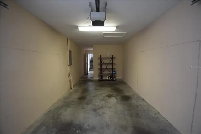 an empty room with a empty space and windows