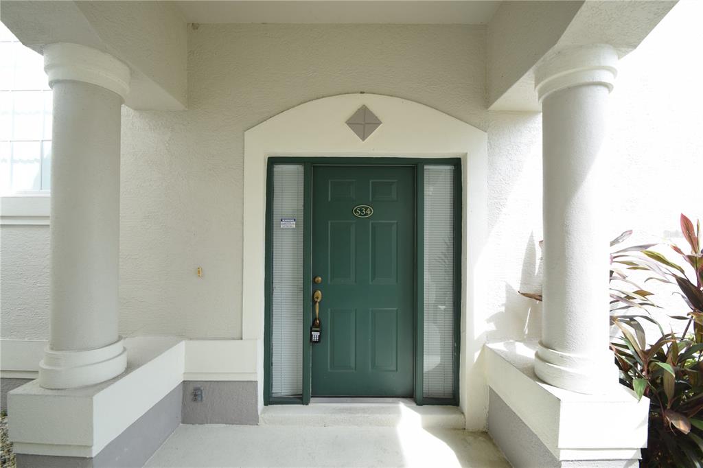 534 Grasslands Village Circle, Unit 534 Lakeland, FL 33803 - Photo 6 of 35 a bathroom with a toilet a sink and bathtub