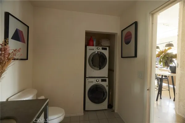 a view of a hallway with washer and dryer