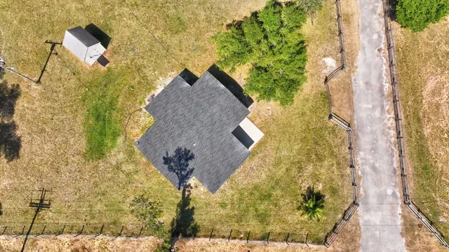 a aerial view of a house with a yard