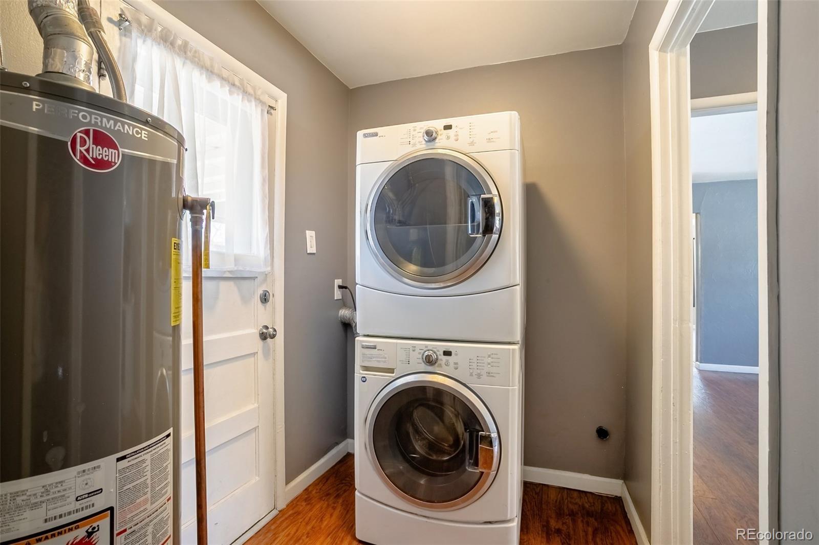 3016 South Grape Way Denver, CO 80222 - Photo 11 of 27 a utility room with dryer and washer