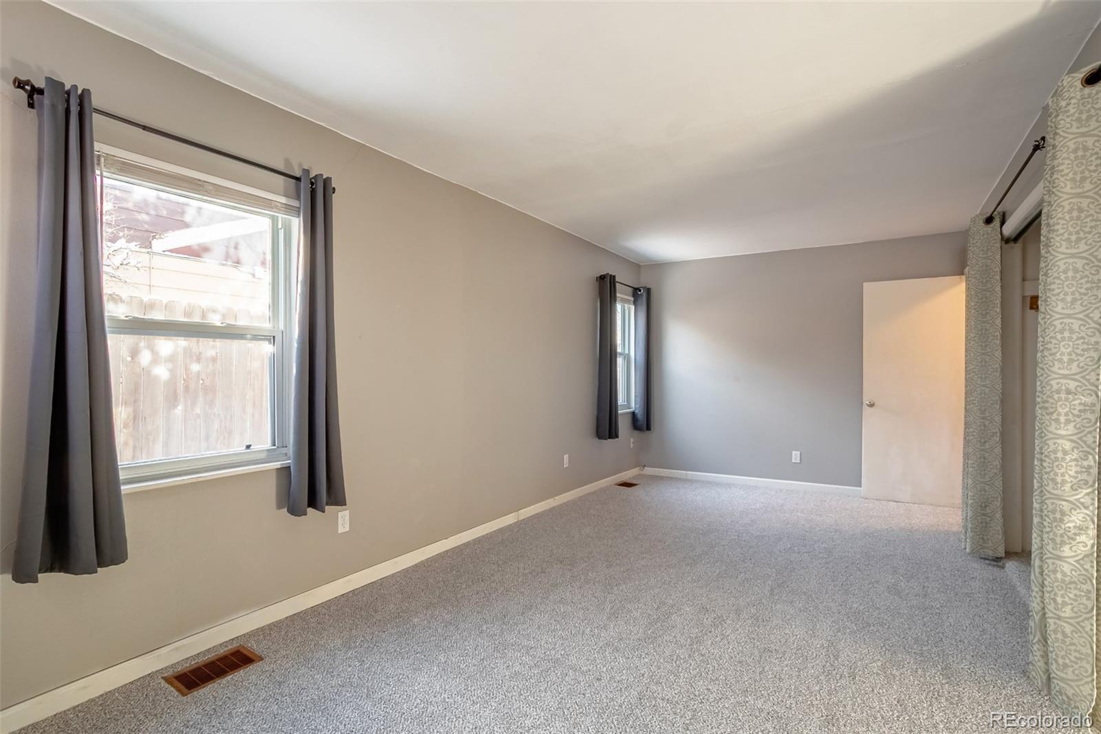 3016 South Grape Way Denver, CO 80222 - Photo 14 of 27 a view of an empty room with a window