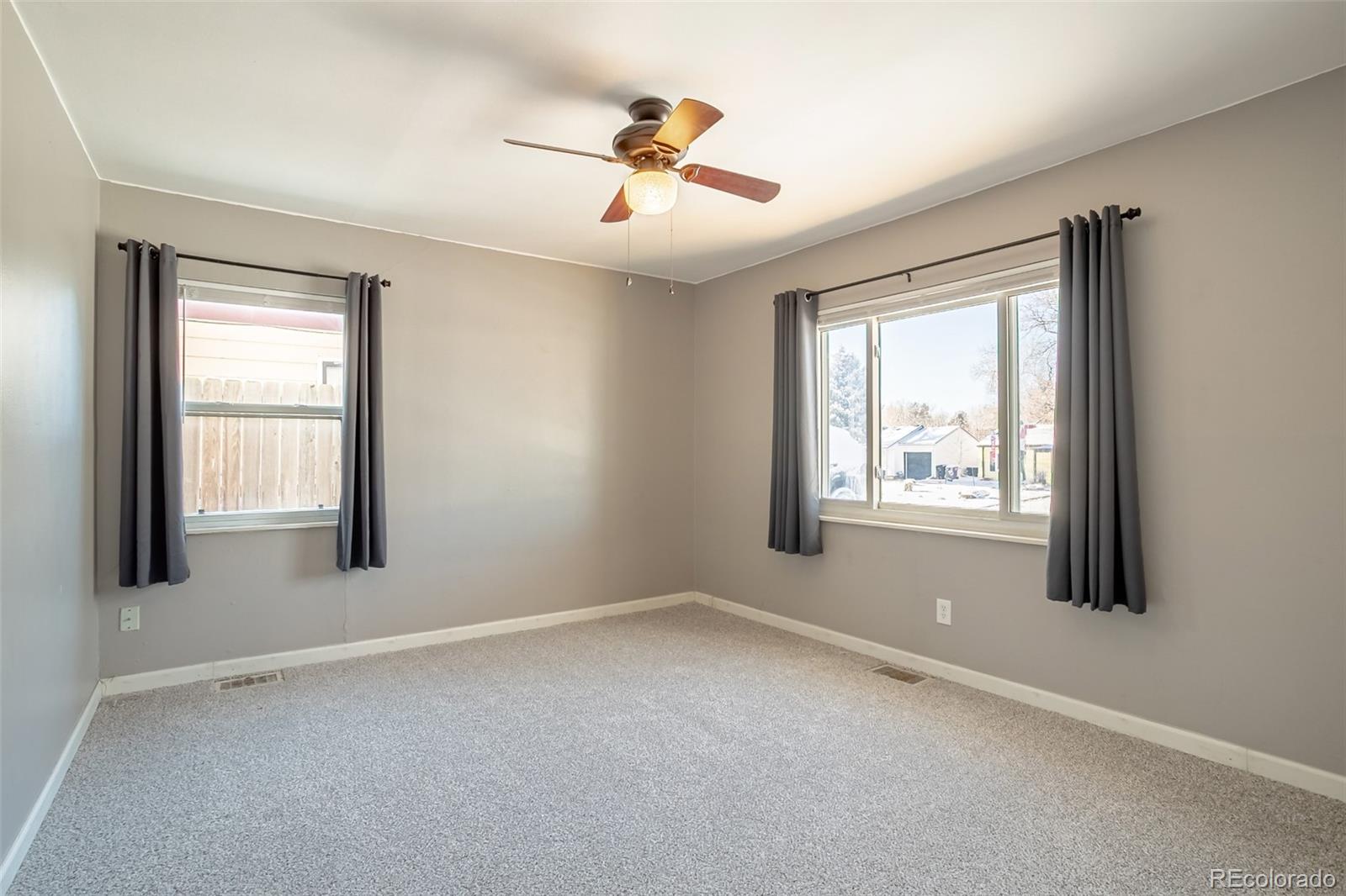 3016 South Grape Way Denver, CO 80222 - Photo 17 of 27 an empty room with a window