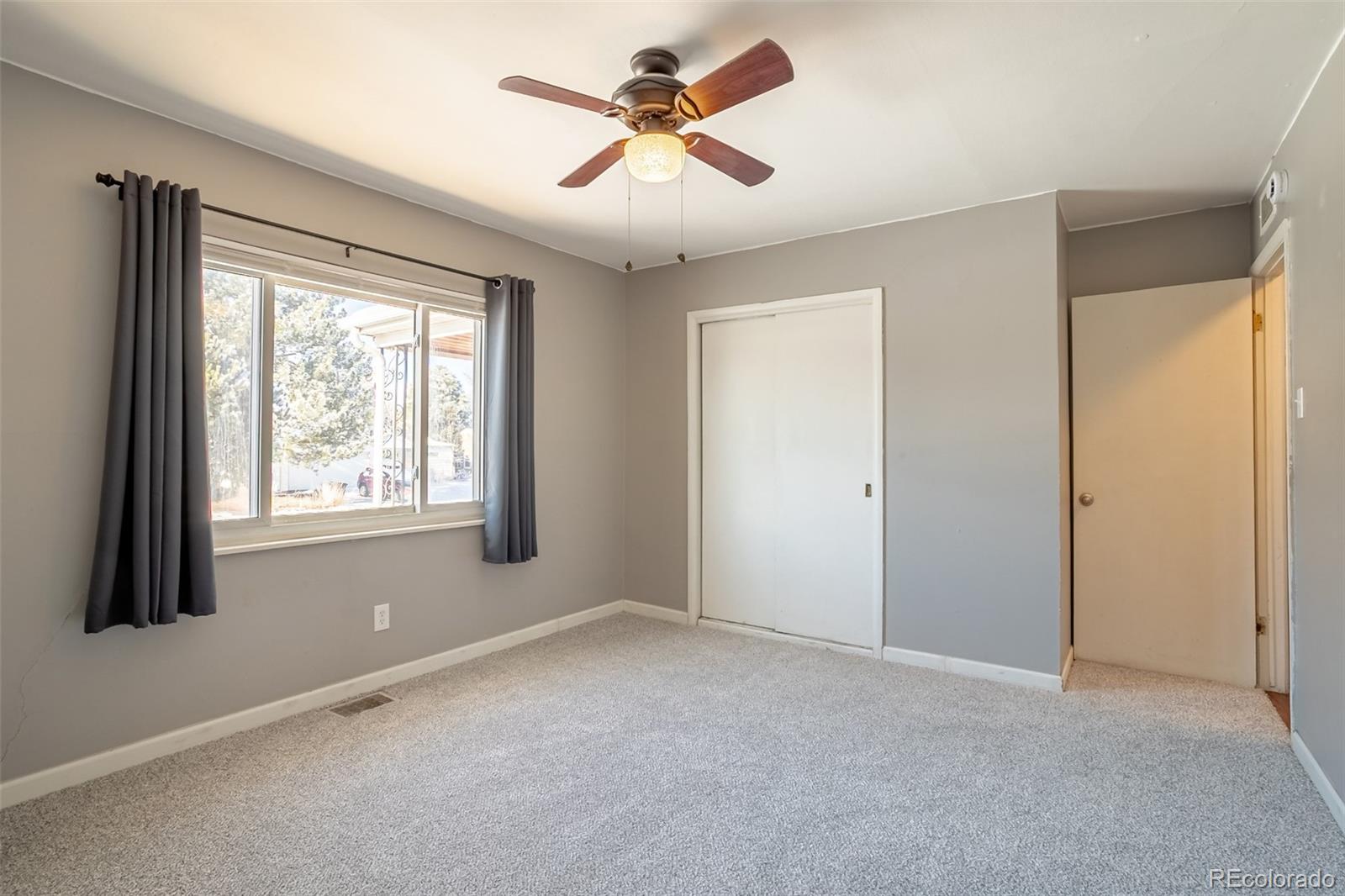 3016 South Grape Way Denver, CO 80222 - Photo 19 of 27 a view of an empty room with a window