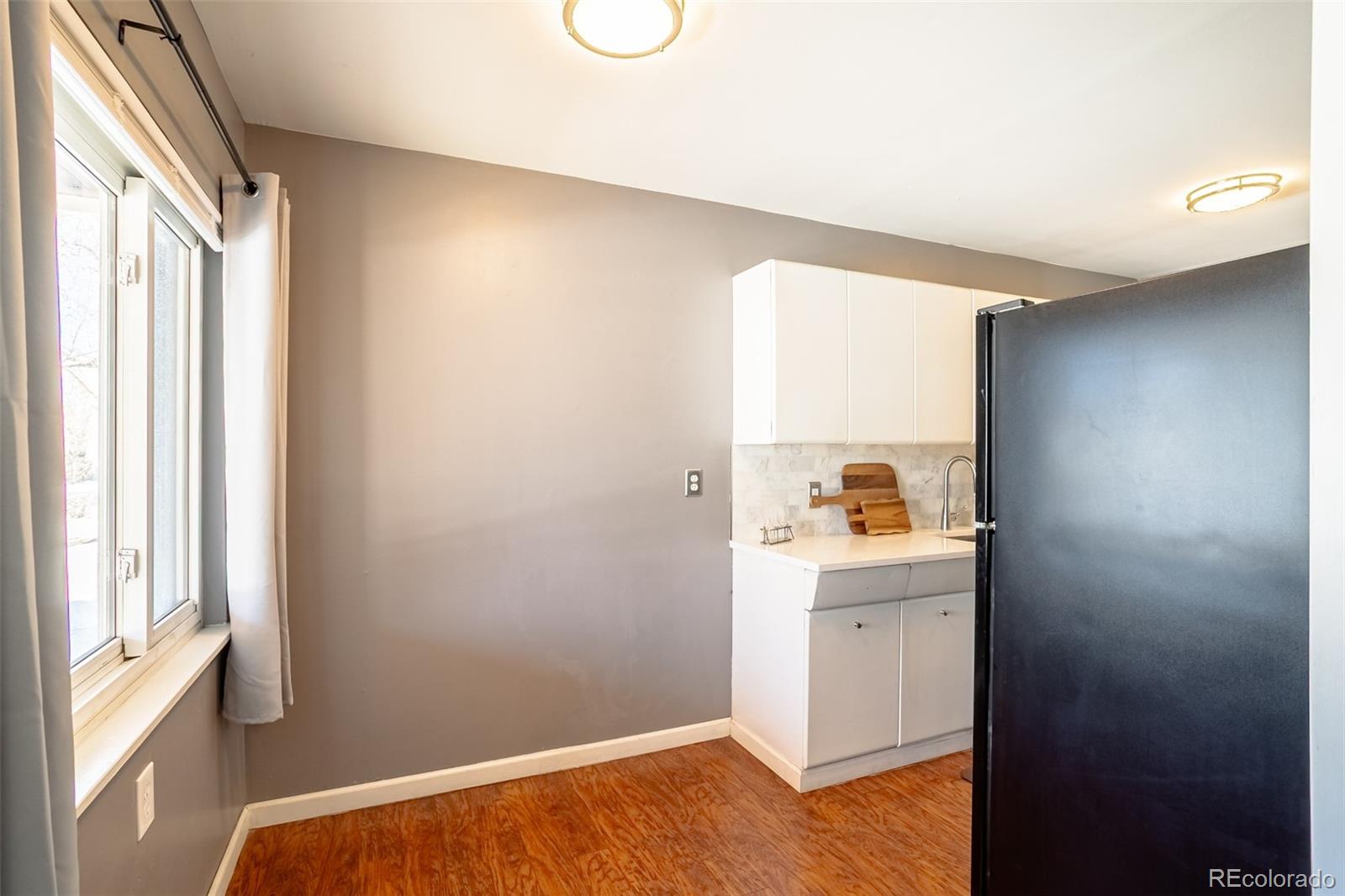 3016 South Grape Way Denver, CO 80222 - Photo 9 of 27 a view of walk in closet with window