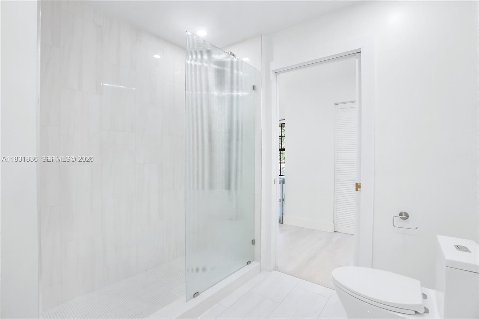 7829 La Mirada Drive Boca Raton, FL 33433 - Photo 15 of 26 a bathroom with a sink a toilet and shower