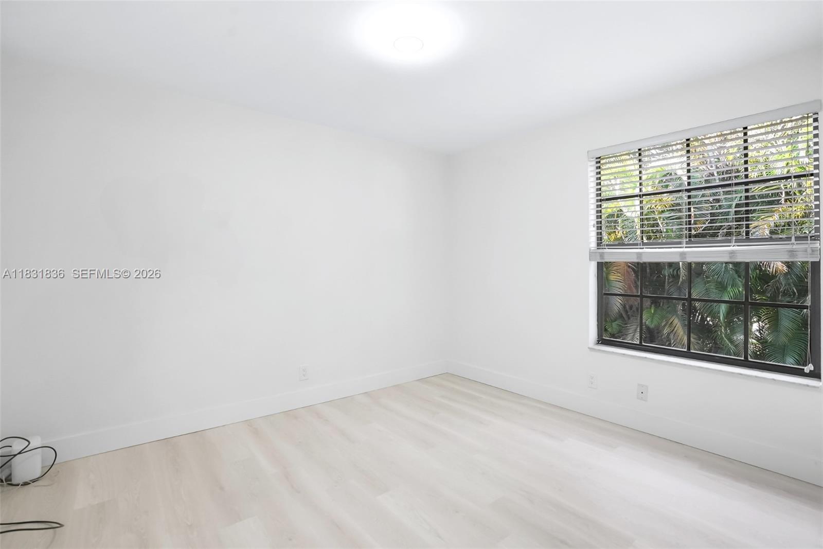 7829 La Mirada Drive Boca Raton, FL 33433 - Photo 17 of 26 an empty room with a window