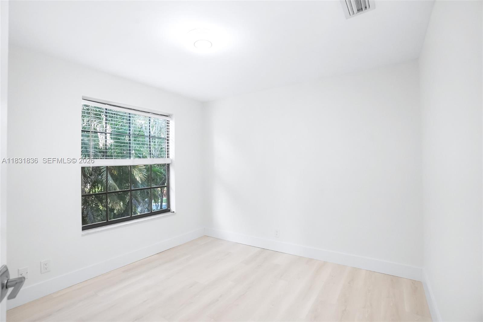 7829 La Mirada Drive Boca Raton, FL 33433 - Photo 19 of 26 a view of an empty room with a window