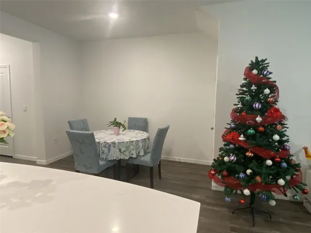 a kitchen with stainless steel appliances a refrigerator and a stove top oven