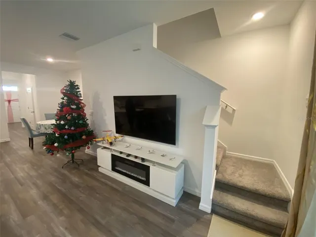 a view of gym equipment and floor to ceiling window