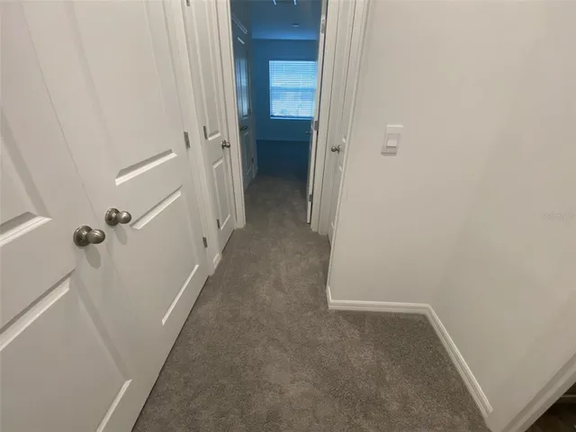 a living room with furniture and a gate