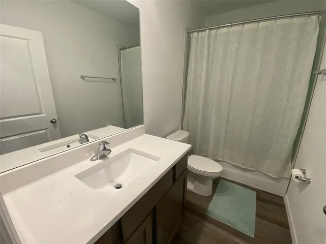 a view of storage and utility room with racks on the wall