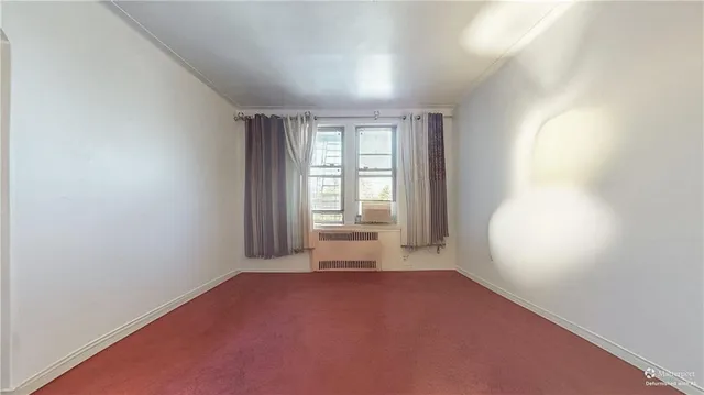 a view of a hallway with a wooden door