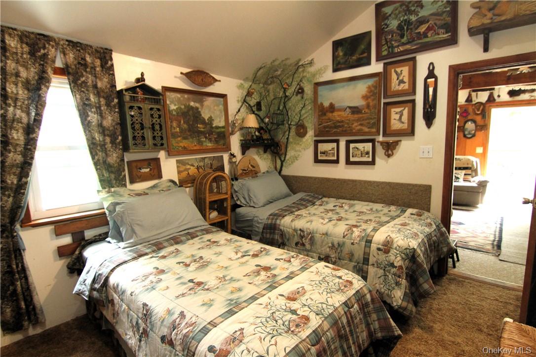 71 Miller Road, Unit 14 Hopewell Junction, NY 12533 - Photo 15 of 21 a bedroom with two beds and painting on the wall