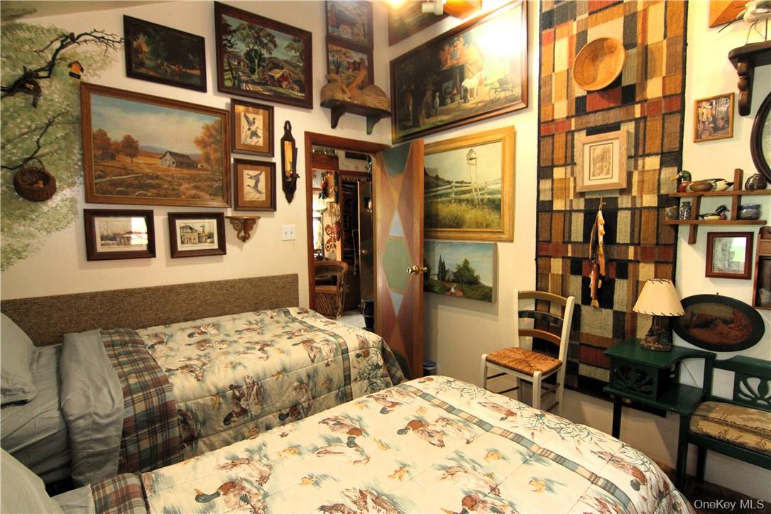 71 Miller Road, Unit 14 Hopewell Junction, NY 12533 - Photo 16 of 21 a bedroom with bed and wooden floor
