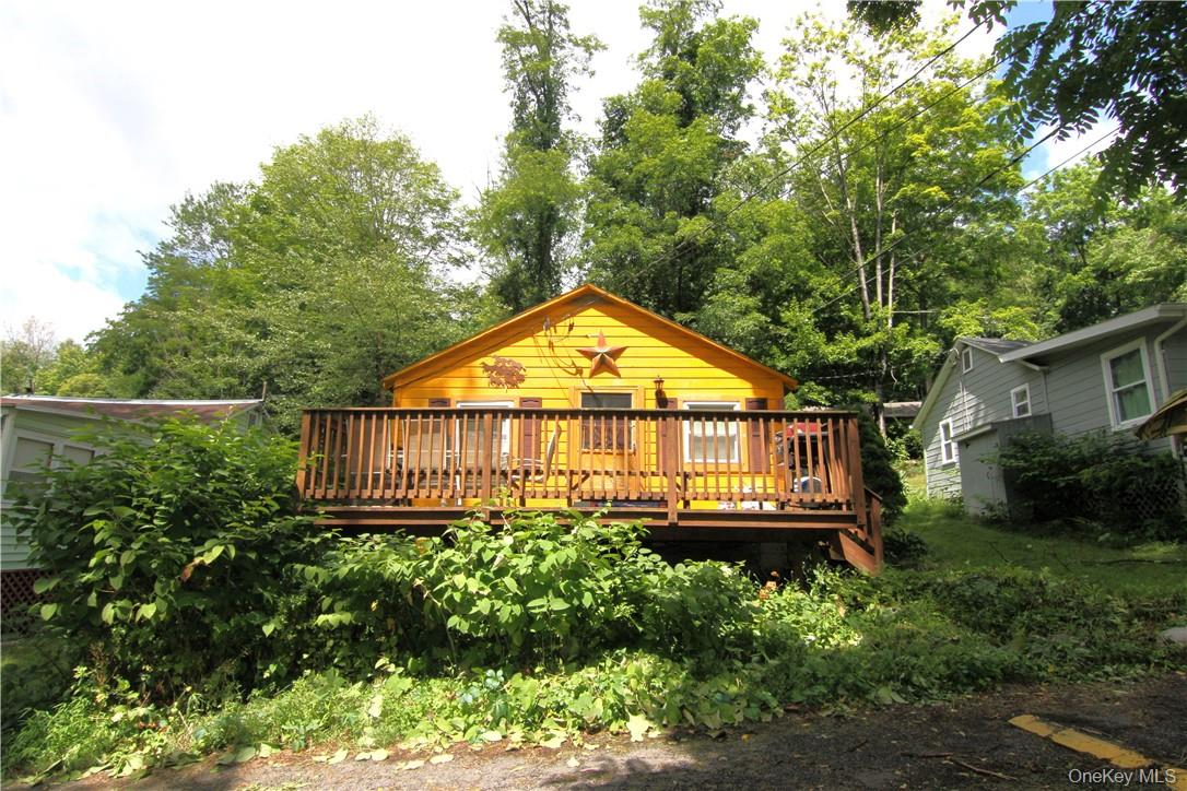 71 Miller Road, Unit 14 Hopewell Junction, NY 12533 - Photo 3 of 21 a view of a house with a small yard and sitting area