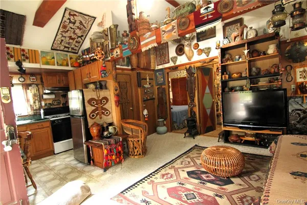 a room with furniture and a flat screen tv