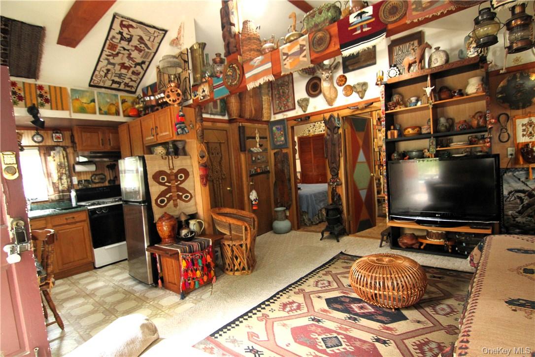 71 Miller Road, Unit 14 Hopewell Junction, NY 12533 - Photo 8 of 21 a room with furniture and a flat screen tv