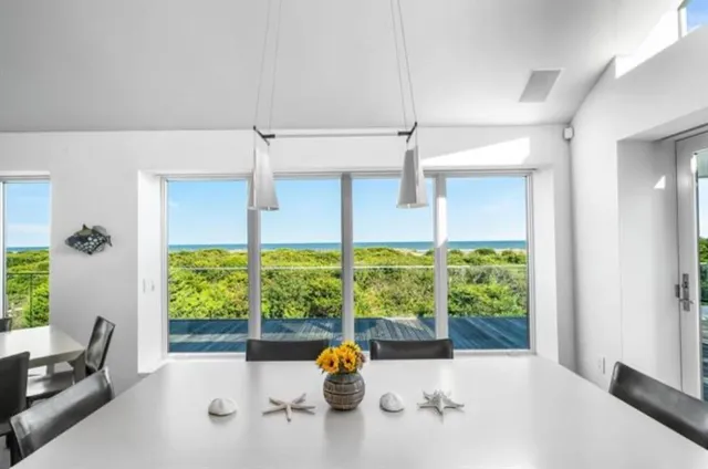a kitchen with a table chairs stove and cabinets