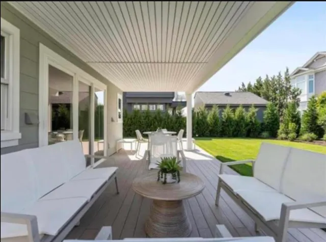 a view of a kitchen with white cabinets