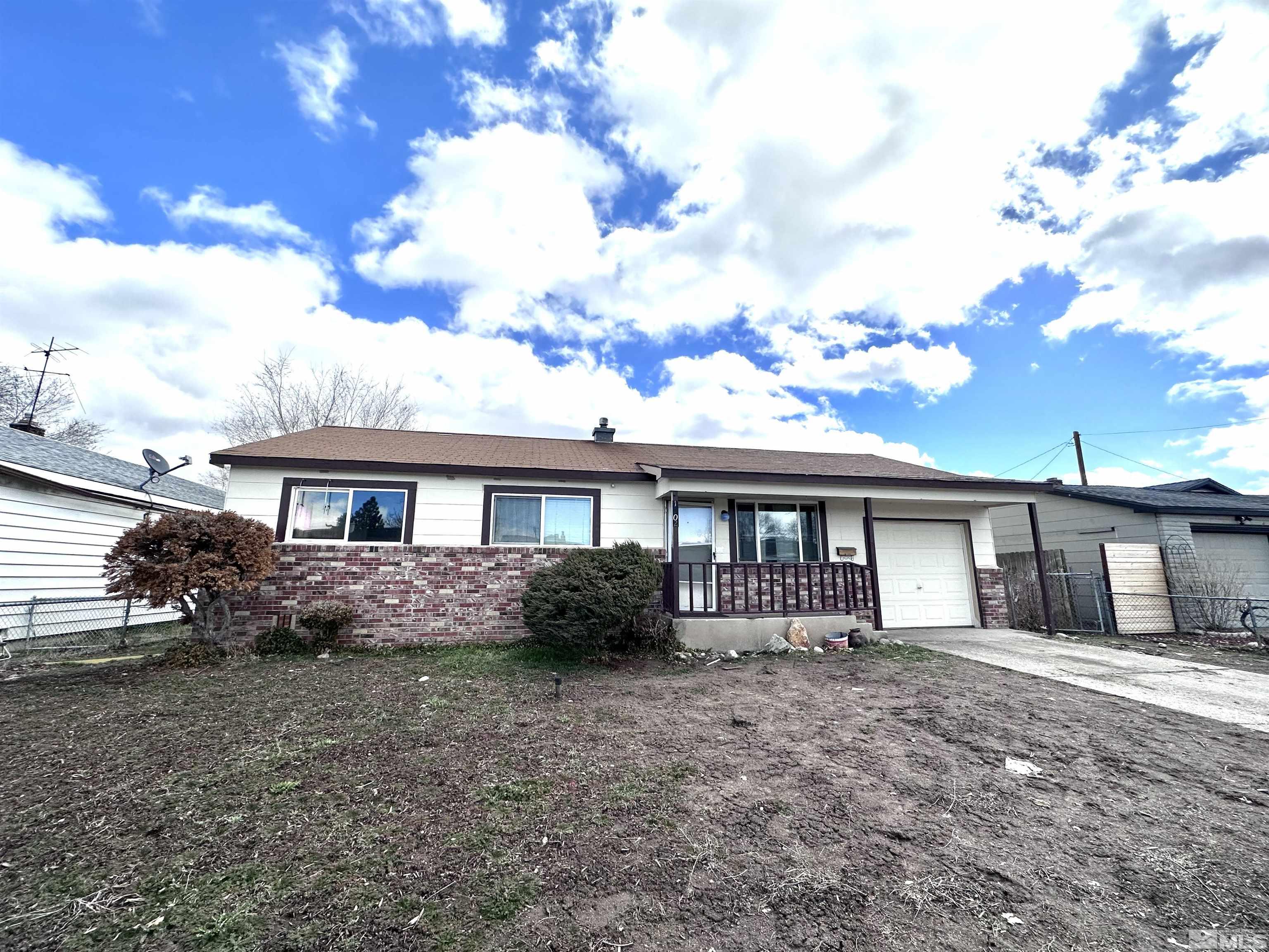 1202 Wilkinson Reno, NV 89503 - Photo 1 of 31 a front view of a house with a garden