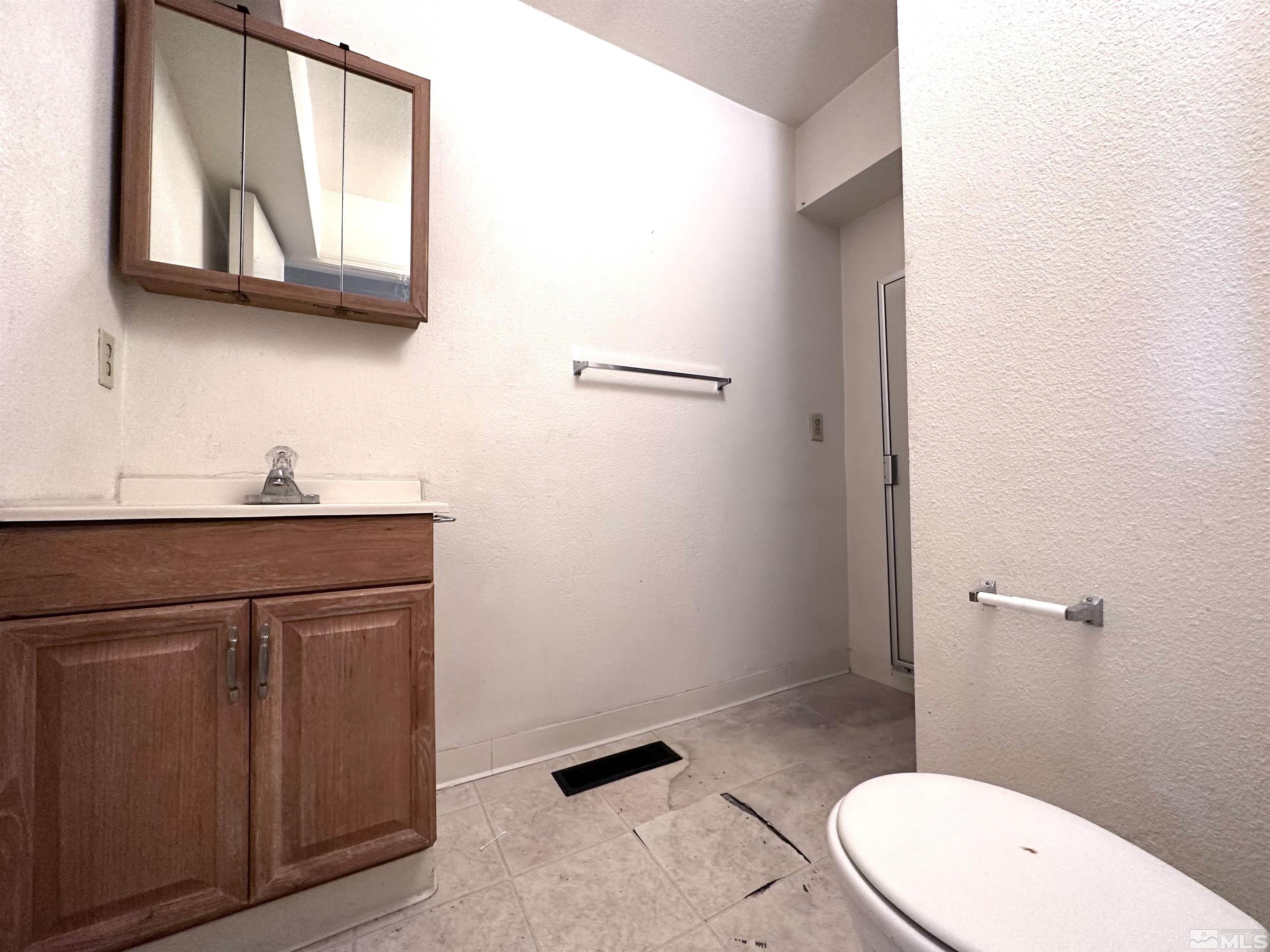 1202 Wilkinson Reno, NV 89503 - Photo 24 of 31 a bathroom with a sink a toilet and mirror