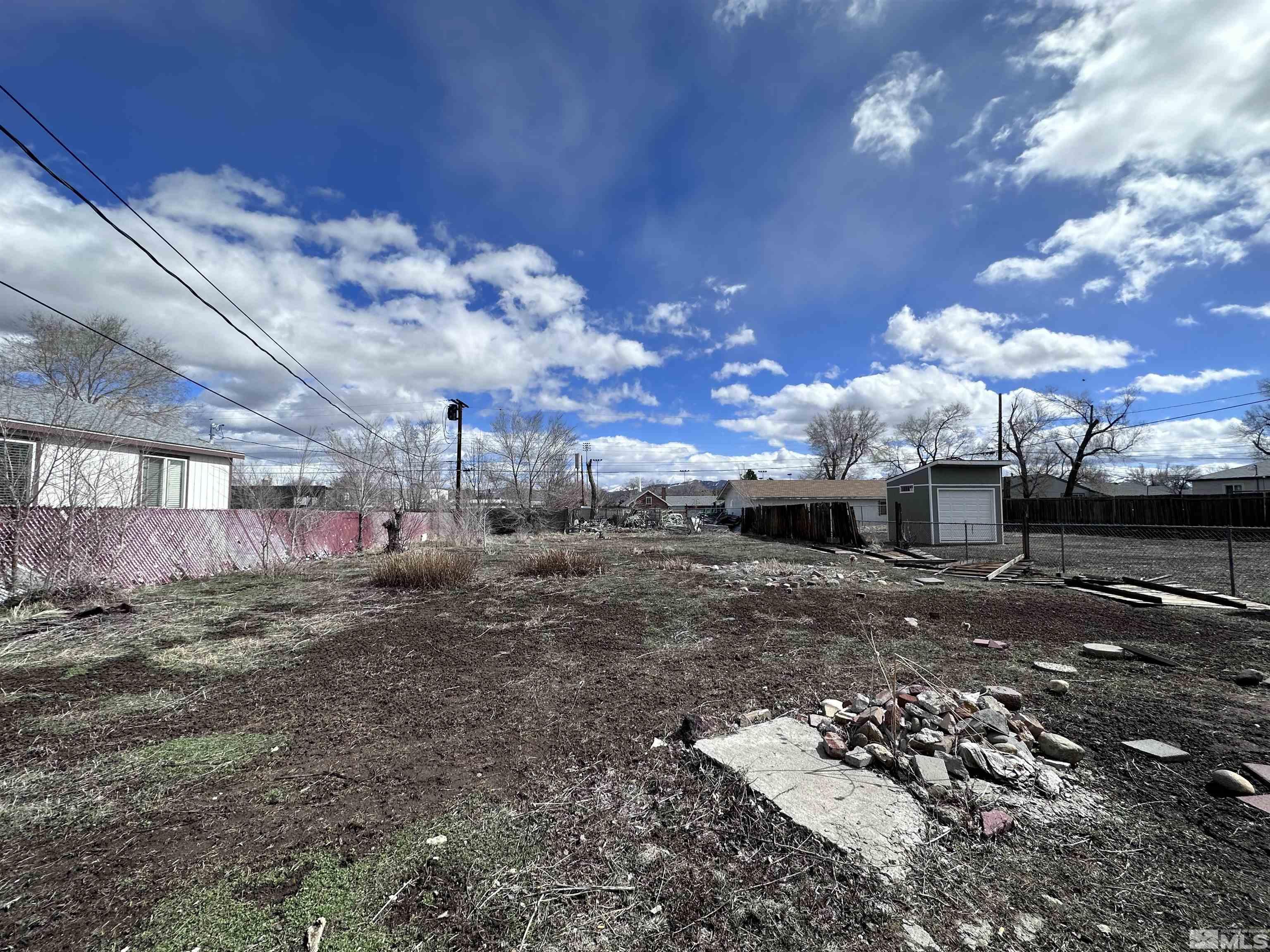 1202 Wilkinson Reno, NV 89503 - Photo 25 of 31 a view of a yard with table and chairs under an umbrella