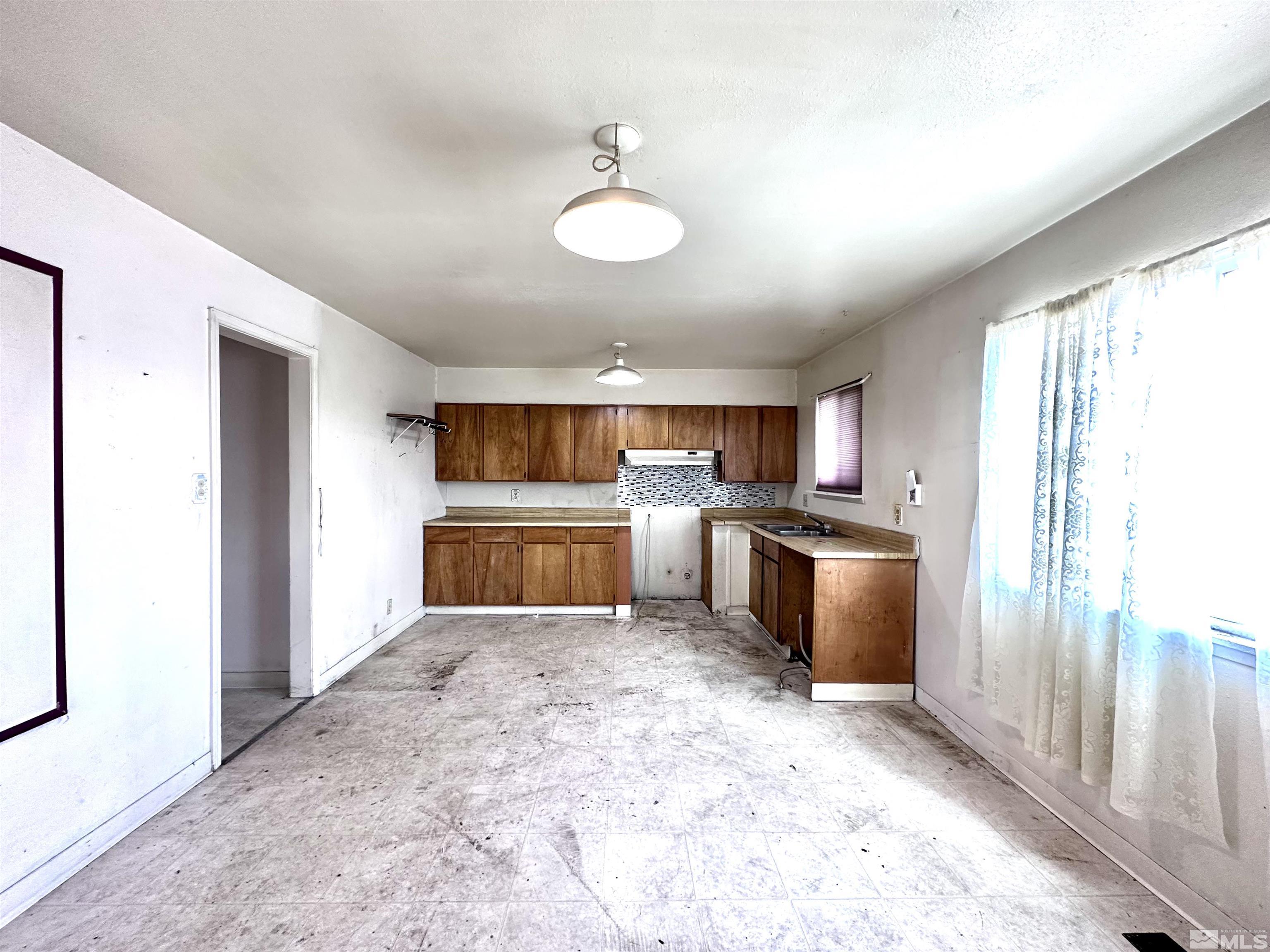 1202 Wilkinson Reno, NV 89503 - Photo 8 of 31 a view of kitchen with cabinets and refrigerator