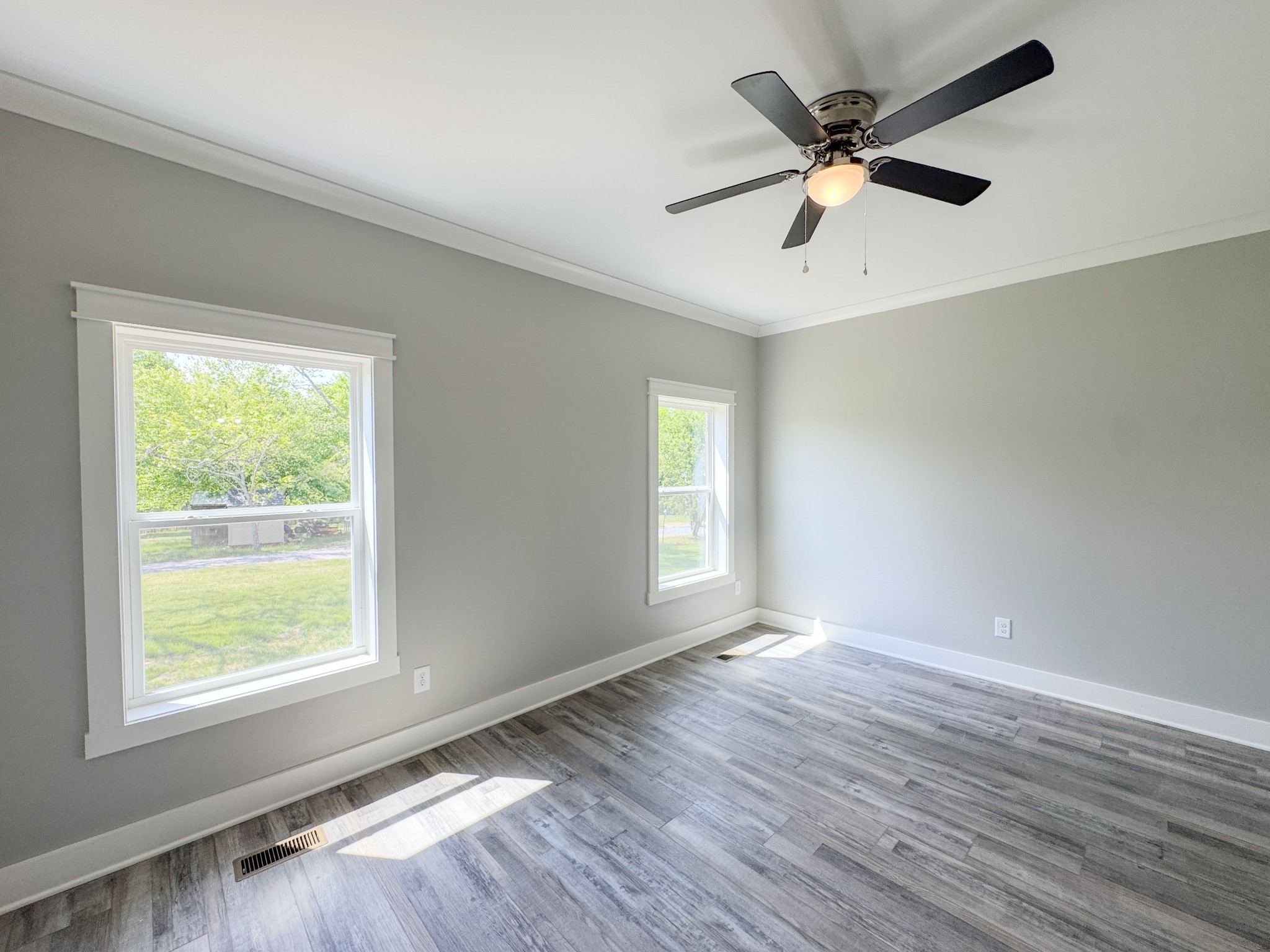 181 Rock House Hollow Road Bethpage, TN 37022 - Photo 26 of 51 a view of an empty room with wooden floor and a window
