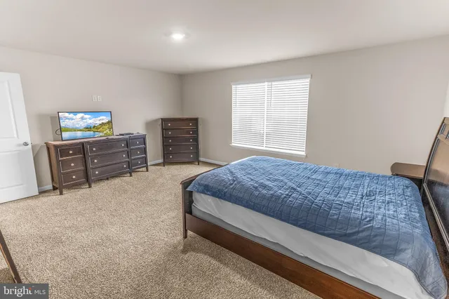 a bedroom with a bed and furniture