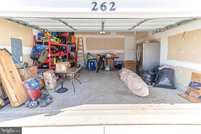 a view of a garage with a bike and car