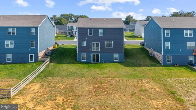 a brick house with a yard and a big yard