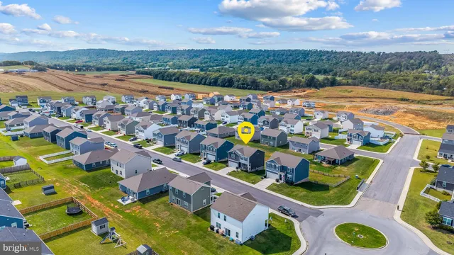 an aerial view of a house with a swimming pool yard and outdoor seating