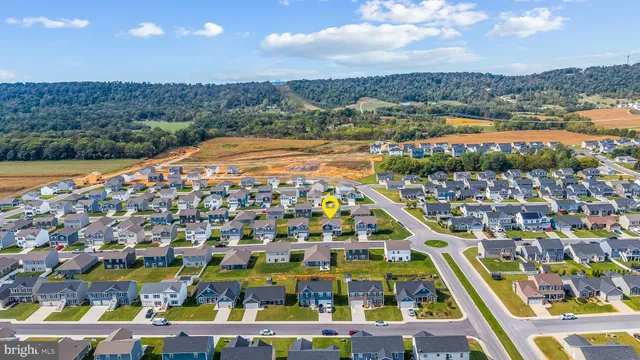 a view of residential houses with outdoor space and river