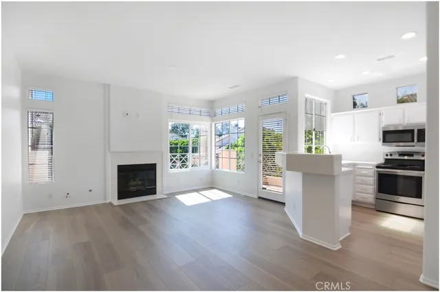 a view of kitchen with cabinets and wooden floor