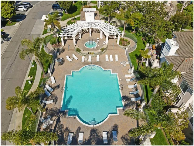 an aerial view of residential house with outdoor space and swimming pool