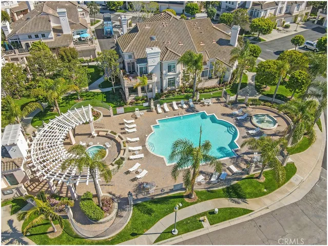 a view of a swimming pool with outdoor seating