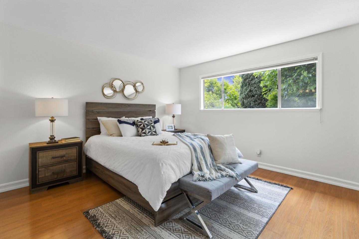 Cadburry Court San Jose, CA 95123 - Photo 14 of 25 a bedroom with a bed and wooden floor