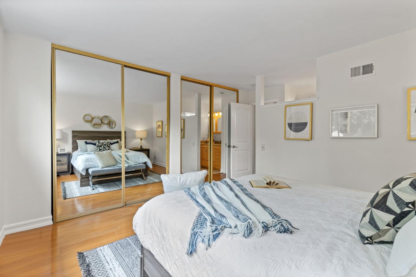 Cadburry Court San Jose, CA 95123 - Photo 15 of 25 a bedroom with a bed and wooden floor