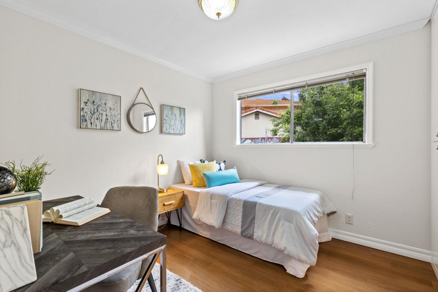 Cadburry Court San Jose, CA 95123 - Photo 18 of 25 a bedroom with a bed and a table